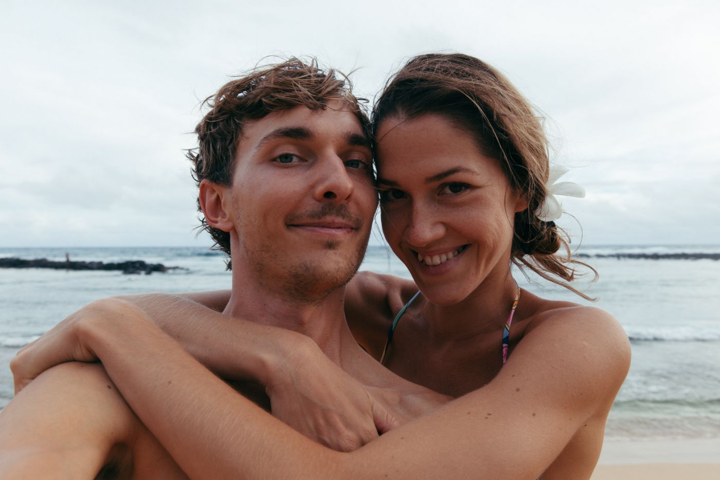 Happy couple at Poi'pu Beach, Kaua'i, Hawai'i