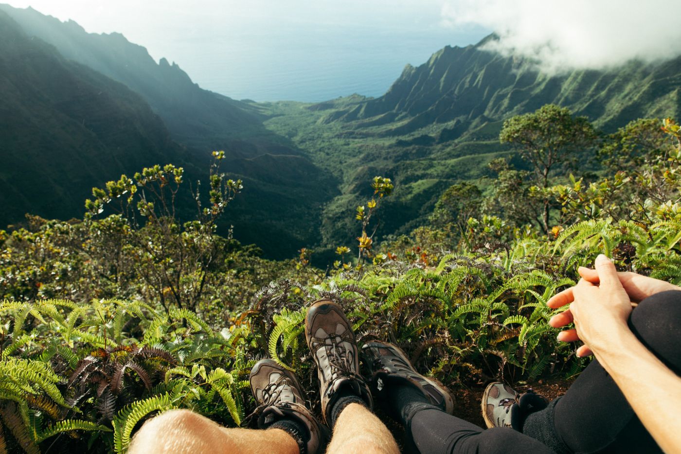 Feet in front of Kalalau Valley seen from above, Koke'e State Park, Kaua'i, Hawaii