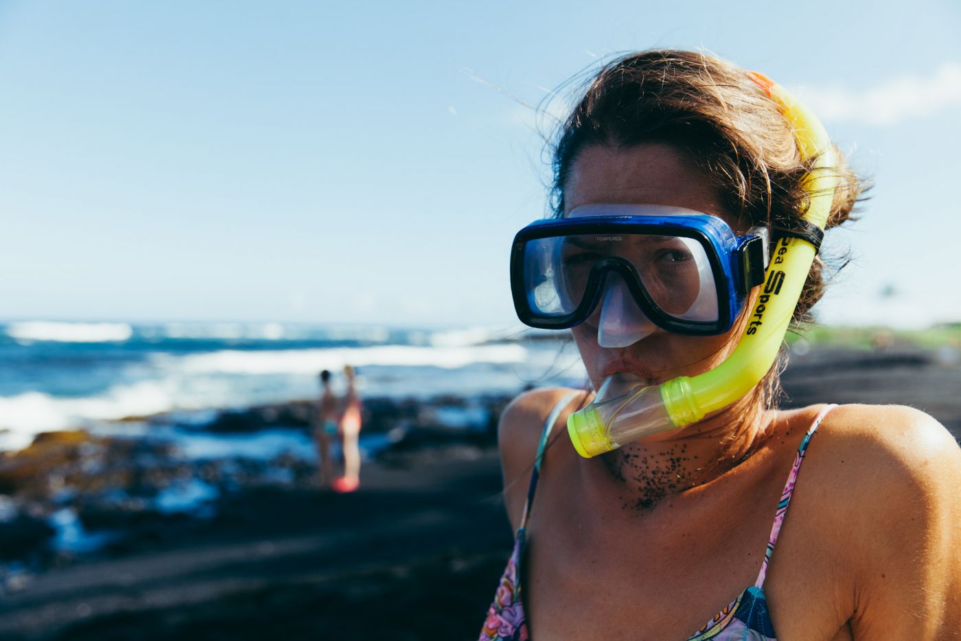 Girl with snorkeling equipment, Punaluu Black Sand Beach, Big Island, Hawaii
