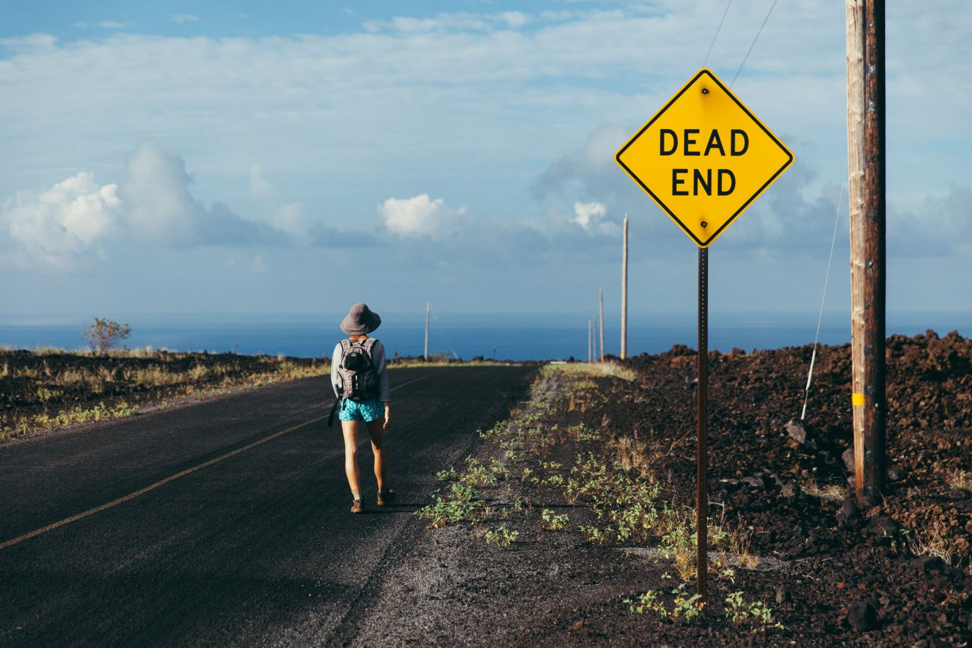 Girl hiking on the road, Ocean View, Big Island, Hawaii