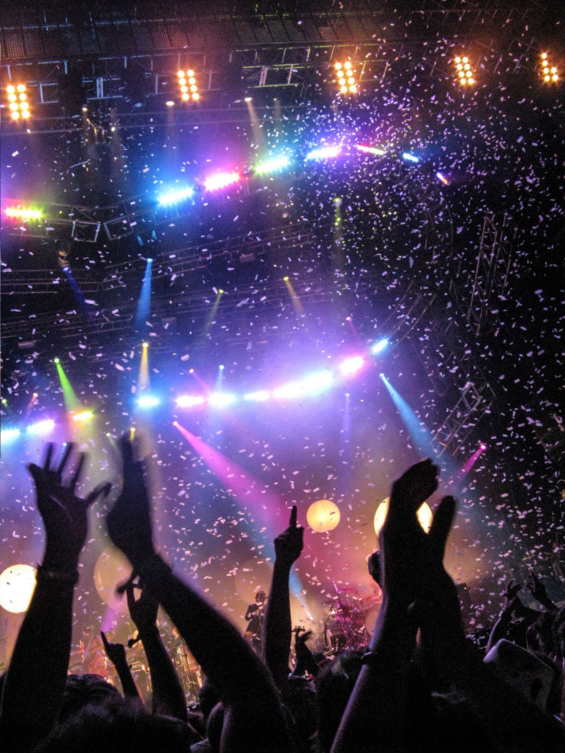 Hands up of crowd in front on stage, confetti, Benicassim Music Festival, Spain
